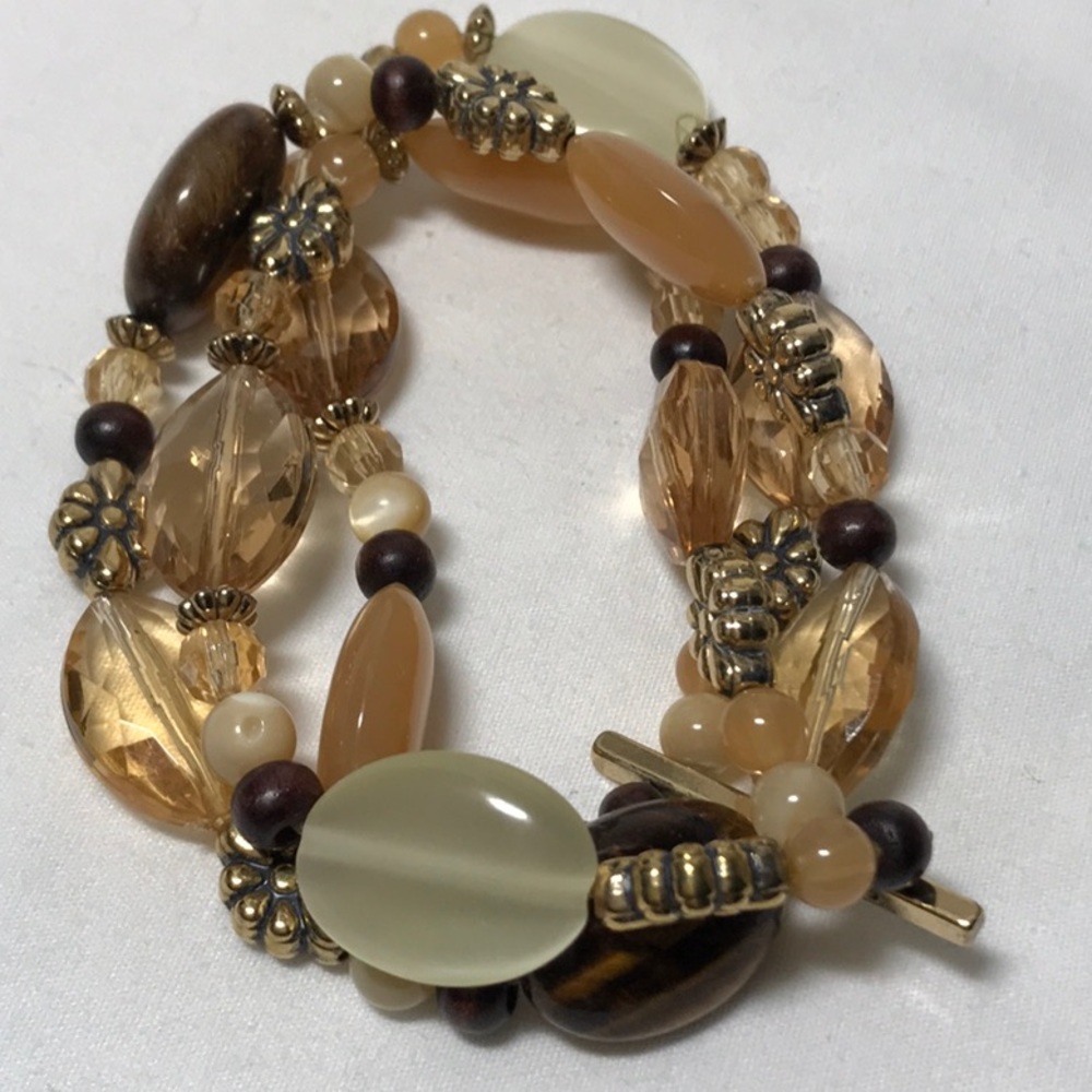 Chaps 3 strand bracelet, stretch is good, peach color beads, gold tone